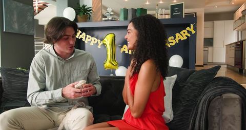 Couple celebrating anniversary with present exchange