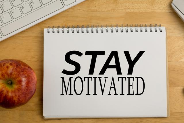 Stay Motivated Message on Notebook with Apple and Keyboard - Download Free Stock Photos Pikwizard.com
