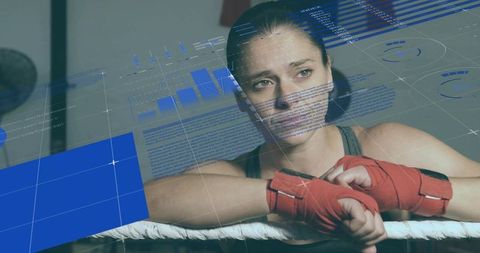 Female Boxer Analyzing Boxing Statistics in Ring