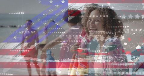 Smiling surfer holding surfboard with american flag overlay on vibrant summer beach