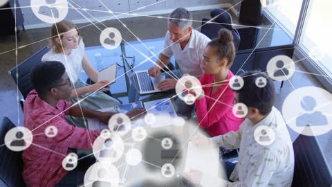 Diverse Team Collaborating in Modern Office with Futuristic Connections