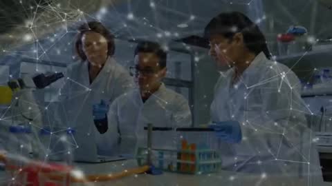 Researchers Analyzing Data with Animated Graphs in Laboratory