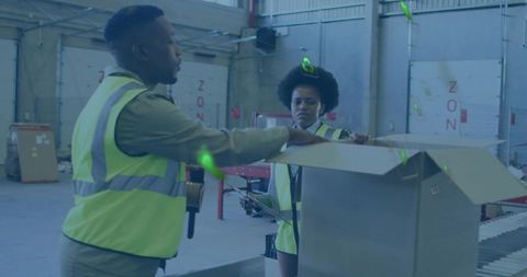 Warehouse workers scanning packages on conveyor belt