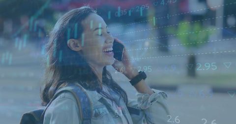 Happy woman on smartphone with digital data overlay