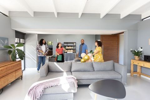 Diverse Group of Friends Celebrating in Modern Living Room