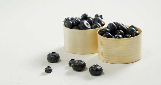 Fresh Blueberries in Wooden Bowls on White Surface - Download Free Stock Images Pikwizard.com