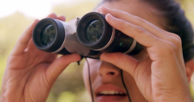 Woman Birdwatching Outdoors with Binoculars on Sunny Day - Download Free Stock Images Pikwizard.com