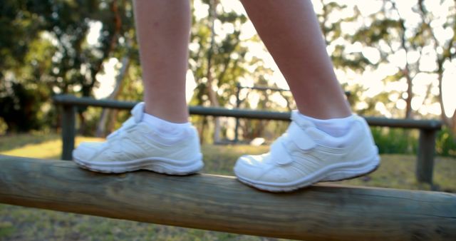 Child Balancing on Wooden Beam in Park - Download Free Stock Images Pikwizard.com