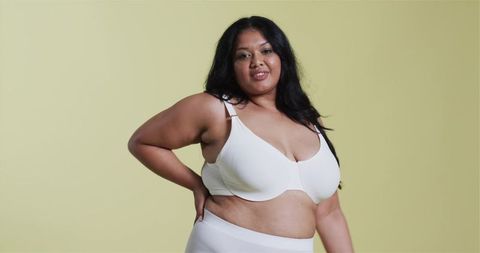 Body Positivity: Confident Asian Woman in Minimalist White Undergarments
