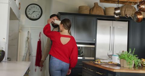 Couple Engaging in Domestic Cooking Activity in Vintage Kitchen