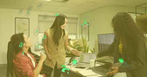 Diverse Team Collaborating on Renewable Energy Innovations in Modern Office