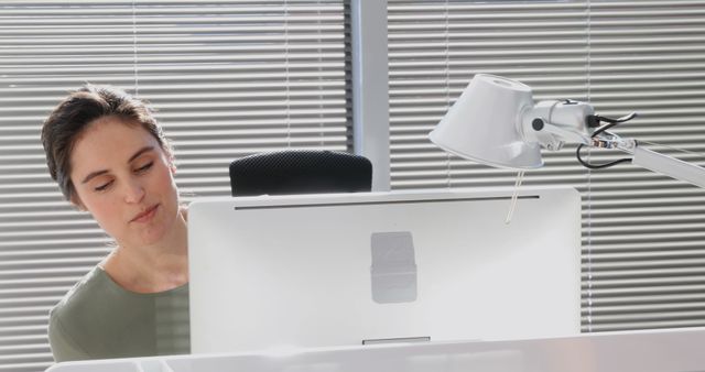 Focused Woman Working at Computer Desk in Office - Download Free Stock Images Pikwizard.com