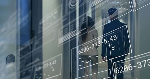 Professionals walking glass corridor with data overlays and dashboards for corporate collaboration