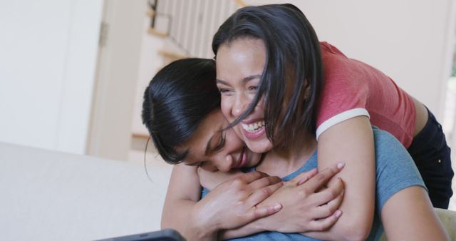 Joyful Mother and Daughter Embracing at Home - Download Free Stock Images Pikwizard.com