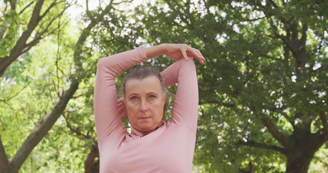 Senior Woman Engaging in Outdoor Stretching Exercise - Download Free Stock Images Pikwizard.com