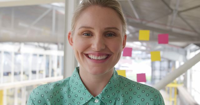 Smiling Businesswoman in Modern Office with Sticky Notes on Glass - Download Free Stock Images Pikwizard.com