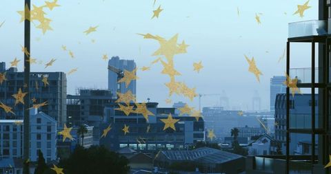 Shining Gold Stars on Window Overlooking Port City Skyline at Dusk