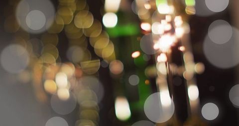 Vibrant celebration sparkler with glowing bokeh lights