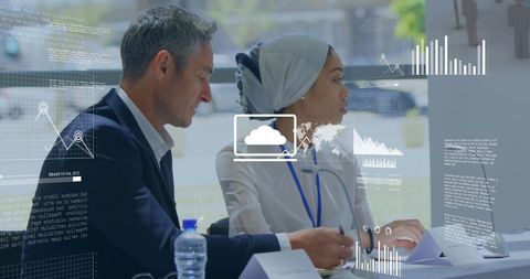 Diverse Business Colleagues Analyzing Data with Digital Interface