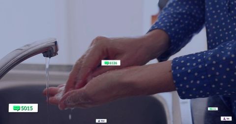 Adult woman washing hands at home for hygiene