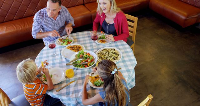 Family Dining at Restaurant Enjoying Lunch Together - Download Free Stock Images Pikwizard.com