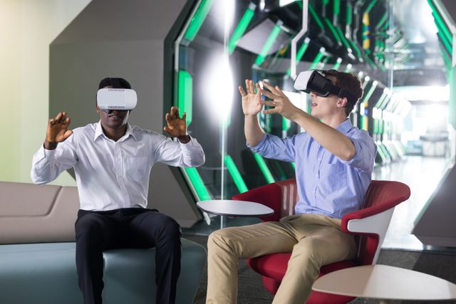 Male executives using virtual reality headset in futuristic office