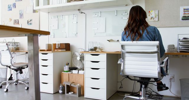 Woman Working in Modern Minimalist Office Setting - Download Free Stock Images Pikwizard.com