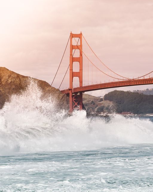 Golden Gate Bridge Behind Crashing Waves at Sunset - Download Free Stock Photos Pikwizard.com