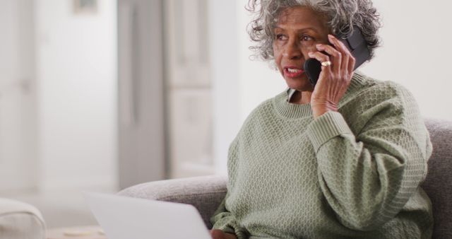 Senior Woman Talking on Phone and Using Laptop at Home - Download Free Stock Images Pikwizard.com