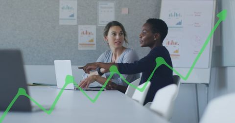 Diverse Female Colleagues Analyzing Business Growth with Graphs