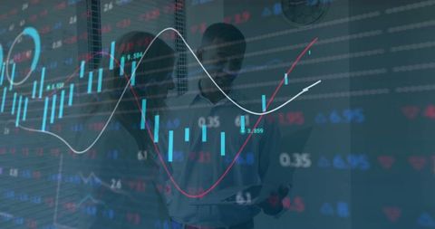 Business analysts reviewing statistics with digital financial graphs