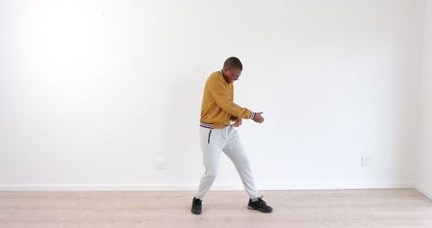 Energetic Young Man Expressing Freestyle Dance Moves