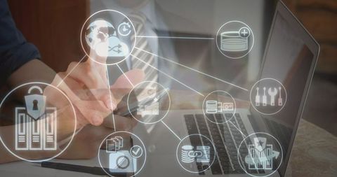 Businessman Analyzing Digital Data with Smartphone and Laptop