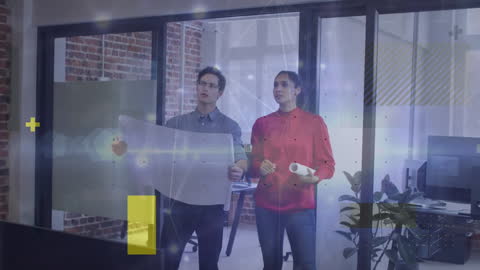 Innovative Business Team Analyzing Project Blueprints in Office