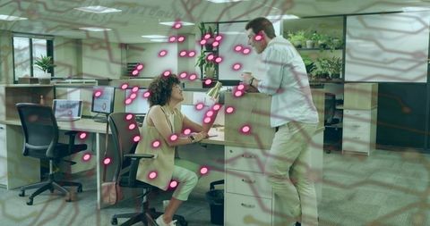 Office colleagues interacting in open workspace with digital overlay