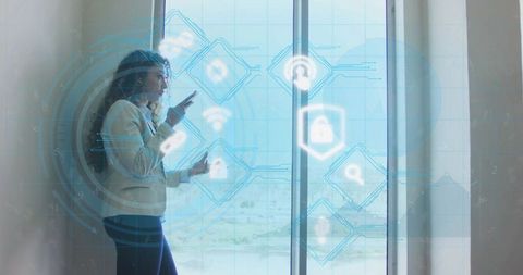 Businesswoman interacting with blue augmented reality interface by glass door office view