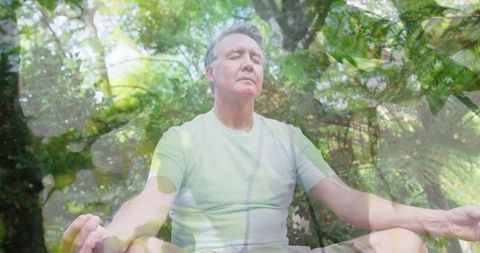 Senior Man Meditating Outdoors Amidst Natural Leaf Overlay