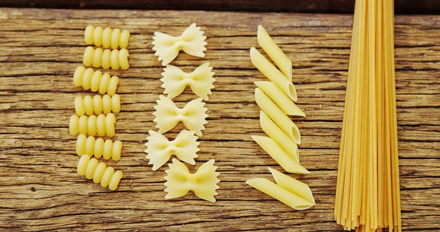 Variety of Raw Pasta on Wooden Table - Download Free Stock Images Pikwizard.com