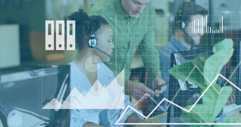 Collaborating Black woman with headset reviewing analytics and charts in open-plan office