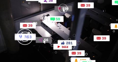 Late night office worker checking social notifications on laptop with floating icons