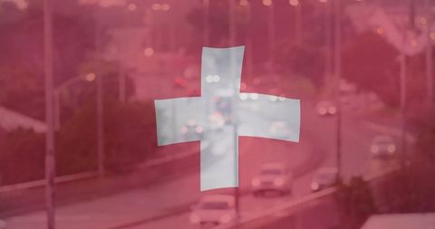 Swiss Flag Overlapping Busy Highway at Dusk with Red Tint