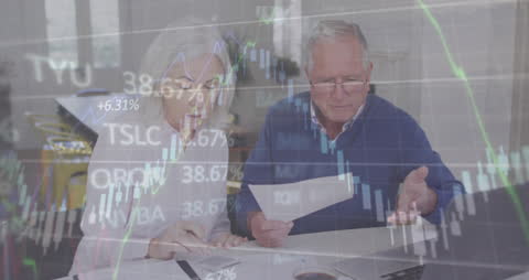 Elderly Couple Analyzing Financial Data with Digital Overlay