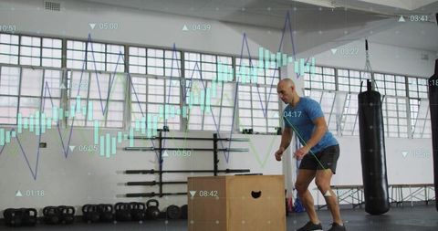 Athlete jumping onto plyo box during explosive jump workout with performance data overlay