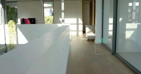 Minimalist mezzanine featuring white railing, sunlit hardwood floor, glass wall, open landing