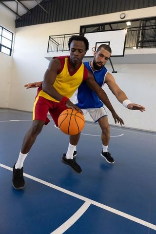 Intense Basketball Match Dual Drama on Indoor Court