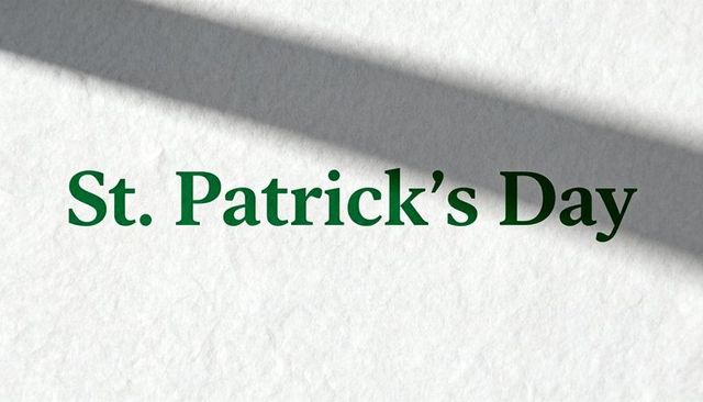 St. Patrick's day green serif typography on textured white cardstock with diagonal shadow