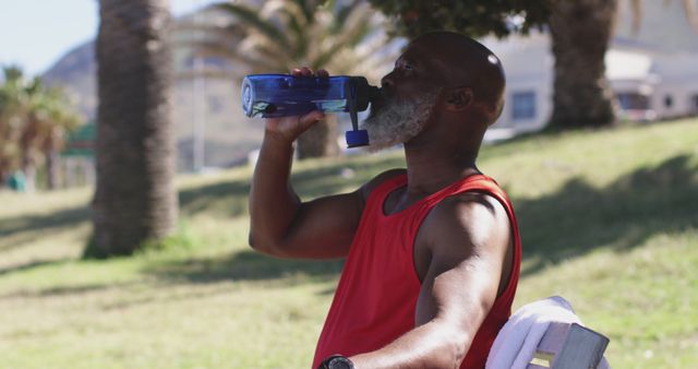 Senior Man Hydrating after Outdoor Exercise in Park - Download Free Stock Images Pikwizard.com