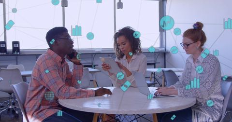 Diverse Team Collaborating with Digital Interface Visuals in Modern Office