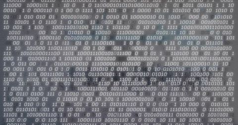 Binary code projection on textured gray surface revealing monochrome matrix pattern