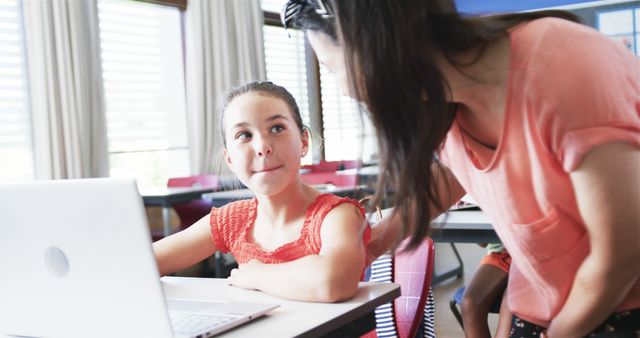 Teacher Helping Student in Classroom with Laptop - Download Free Stock Images Pikwizard.com